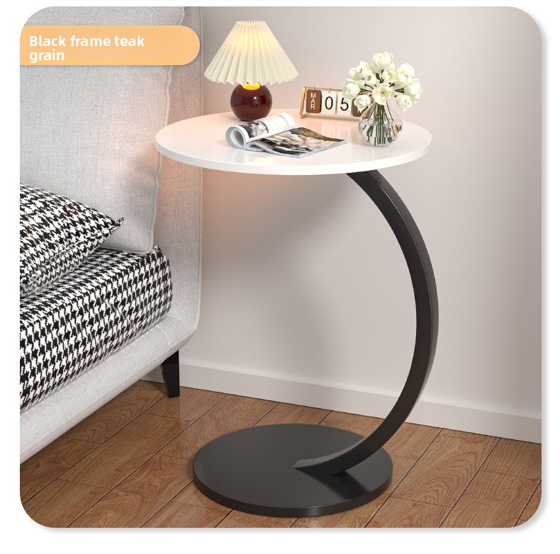 Mesa auxiliar redonda de madera con marco de metal curvado_voghion.com