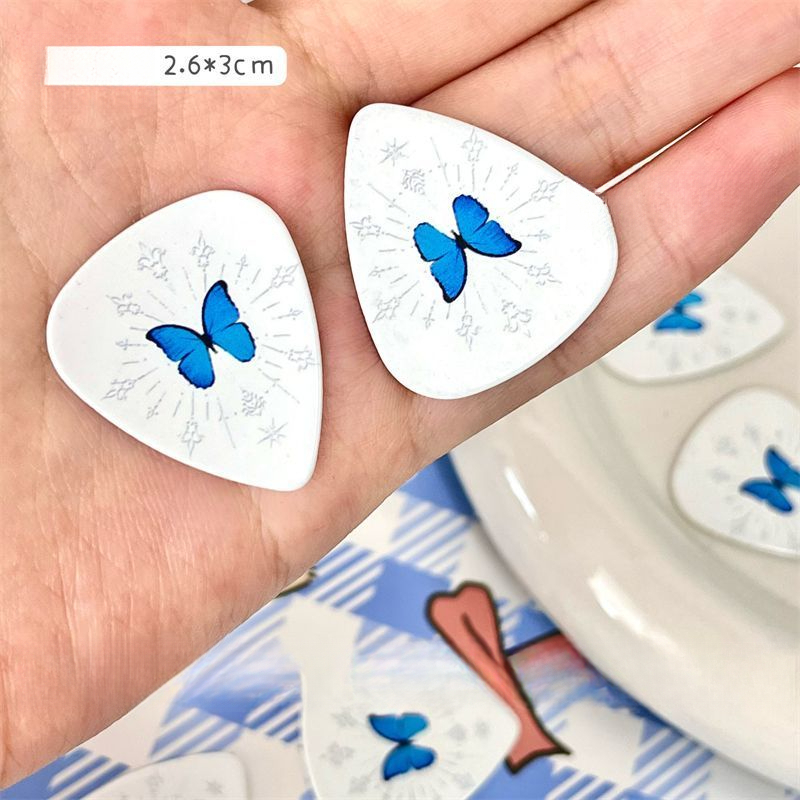 Palheta de guitarra com borboleta azul para baixo e elétrica_voghion.com