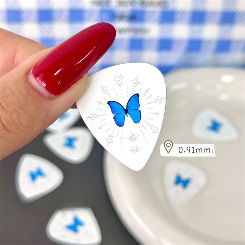 Palheta de guitarra com borboleta azul para baixo e elétrica_voghion.com