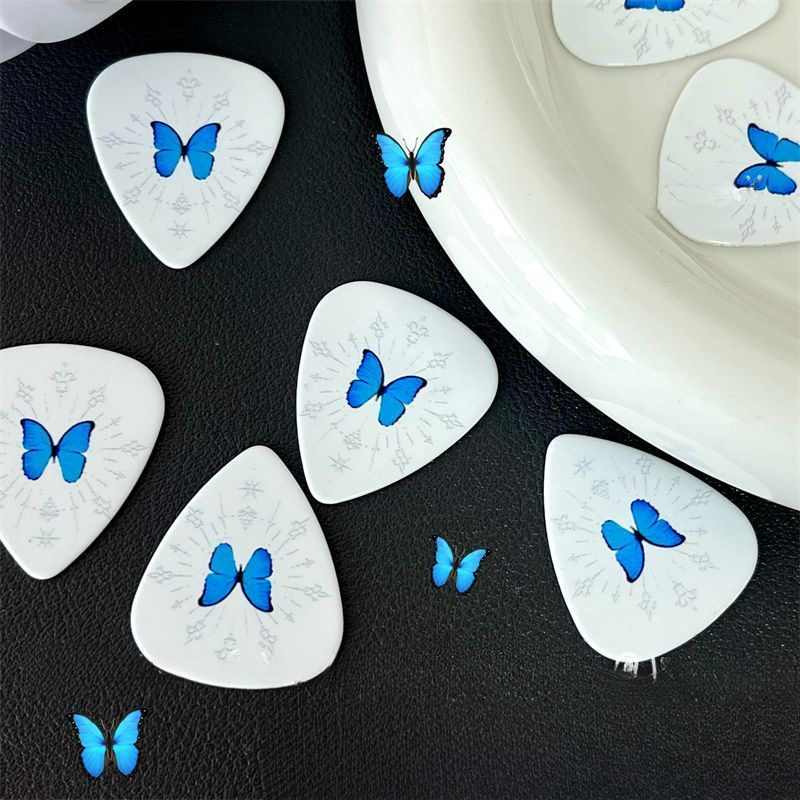 Palheta de guitarra com borboleta azul para baixo e elétrica_voghion.com